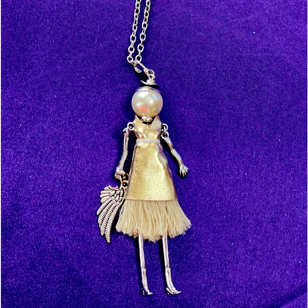 A 3 1/2” fashionista on a 28” Necklace